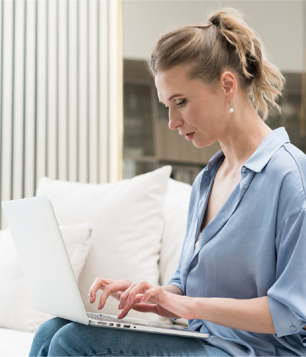 Coordinator working through claims on a laptop